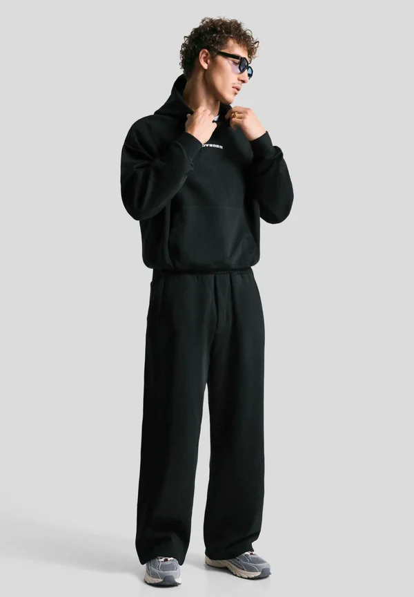 SUPER - Tracksuit bottoms - black