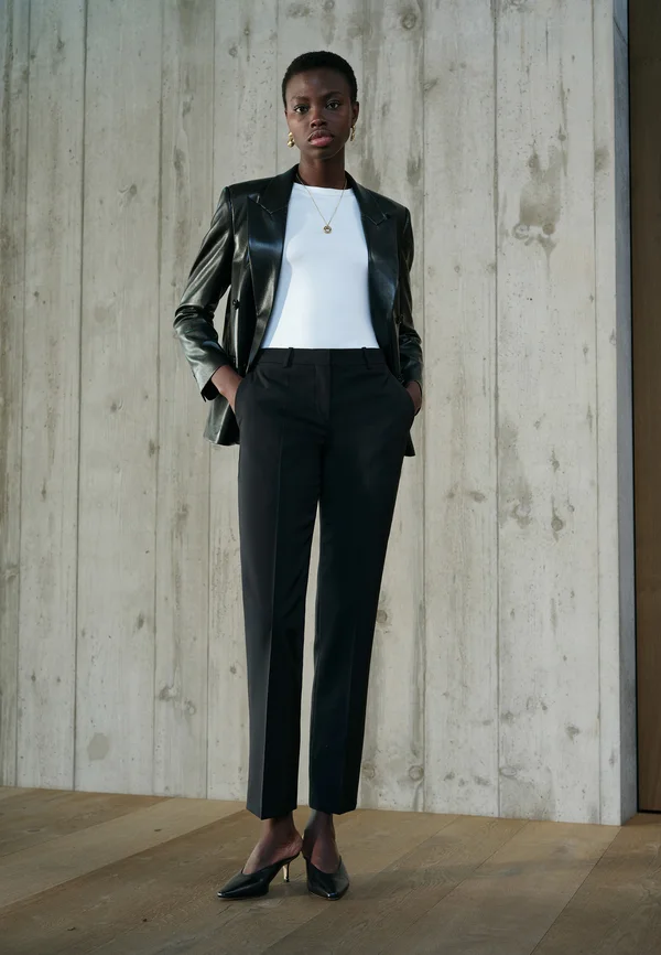 TAMEAH - Trousers - black