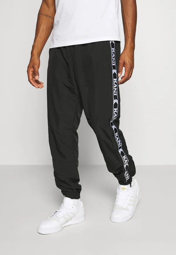 TAPE TRACKPANTS - Tracksuit bottoms - black