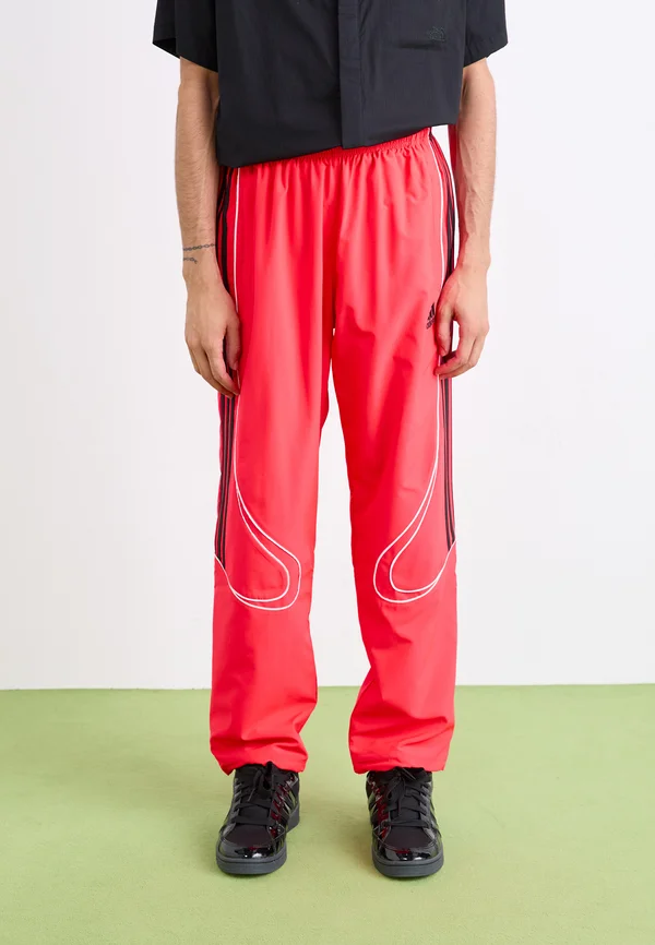 TEAMGEIST  - Tracksuit bottoms - lucid red/black
