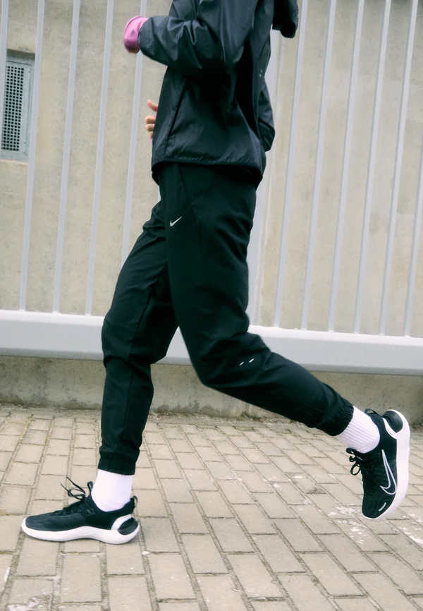 TEMPO WARM PANT - Tracksuit bottoms - black/reflective silver-coloured