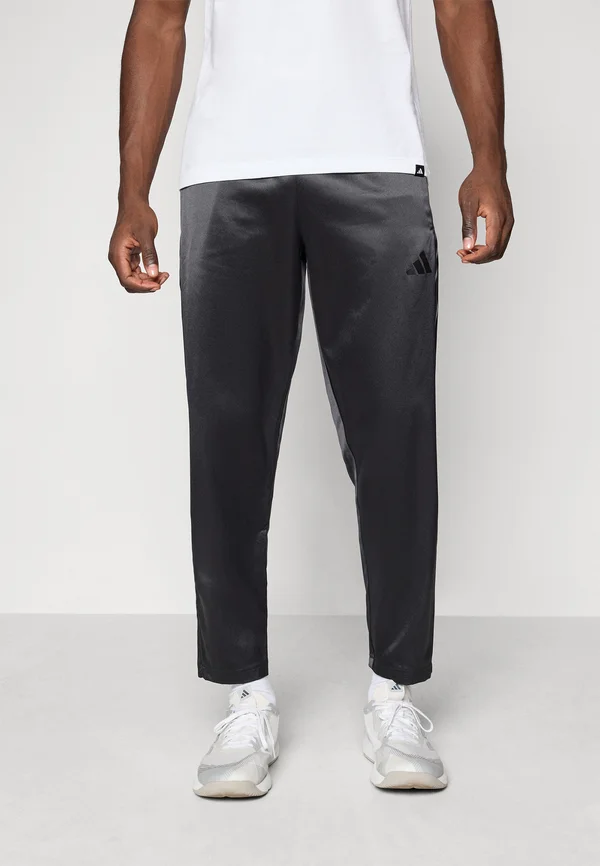 TIRO - Tracksuit bottoms - black