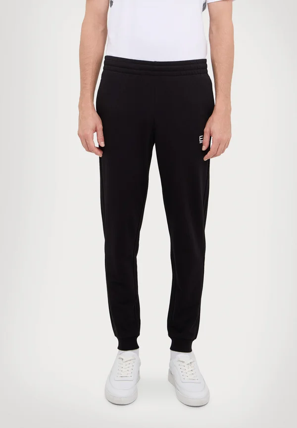 TRAIN CORE PANTS - Tracksuit bottoms - black