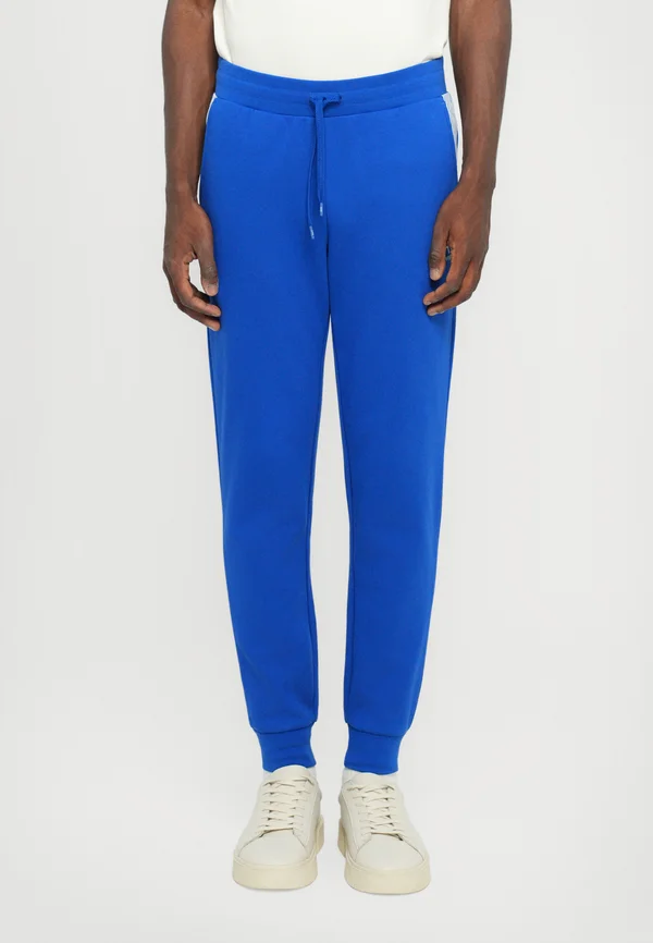 TRAIN LINES PANTS - Tracksuit bottoms - surf the web