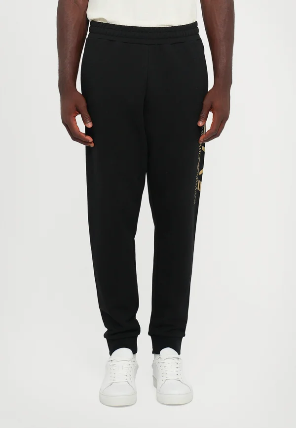 TRAIN LOGOSERIES - Tracksuit bottoms - black