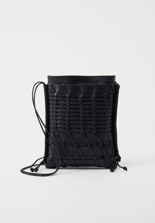 TRENA UNISEX - Cross body bag - black