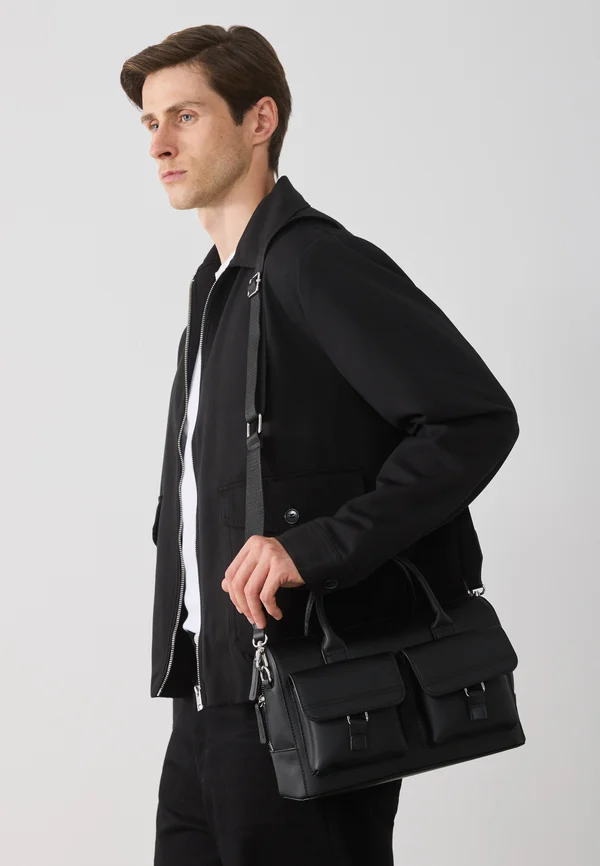 UNISEX - Cross body bag - black