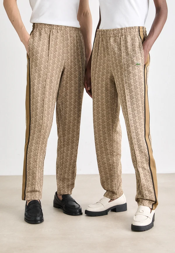 UNISEX - Tracksuit bottoms - croissant/cookie