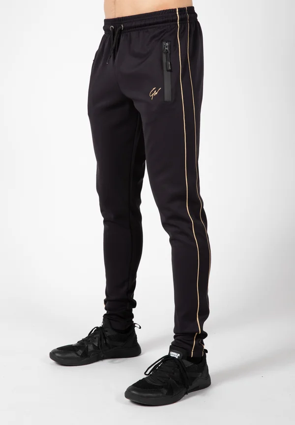 WENDEN - Tracksuit bottoms - gold-coloured